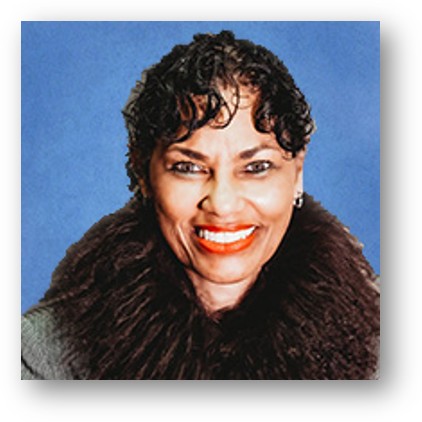 Woman with long curly black hair.