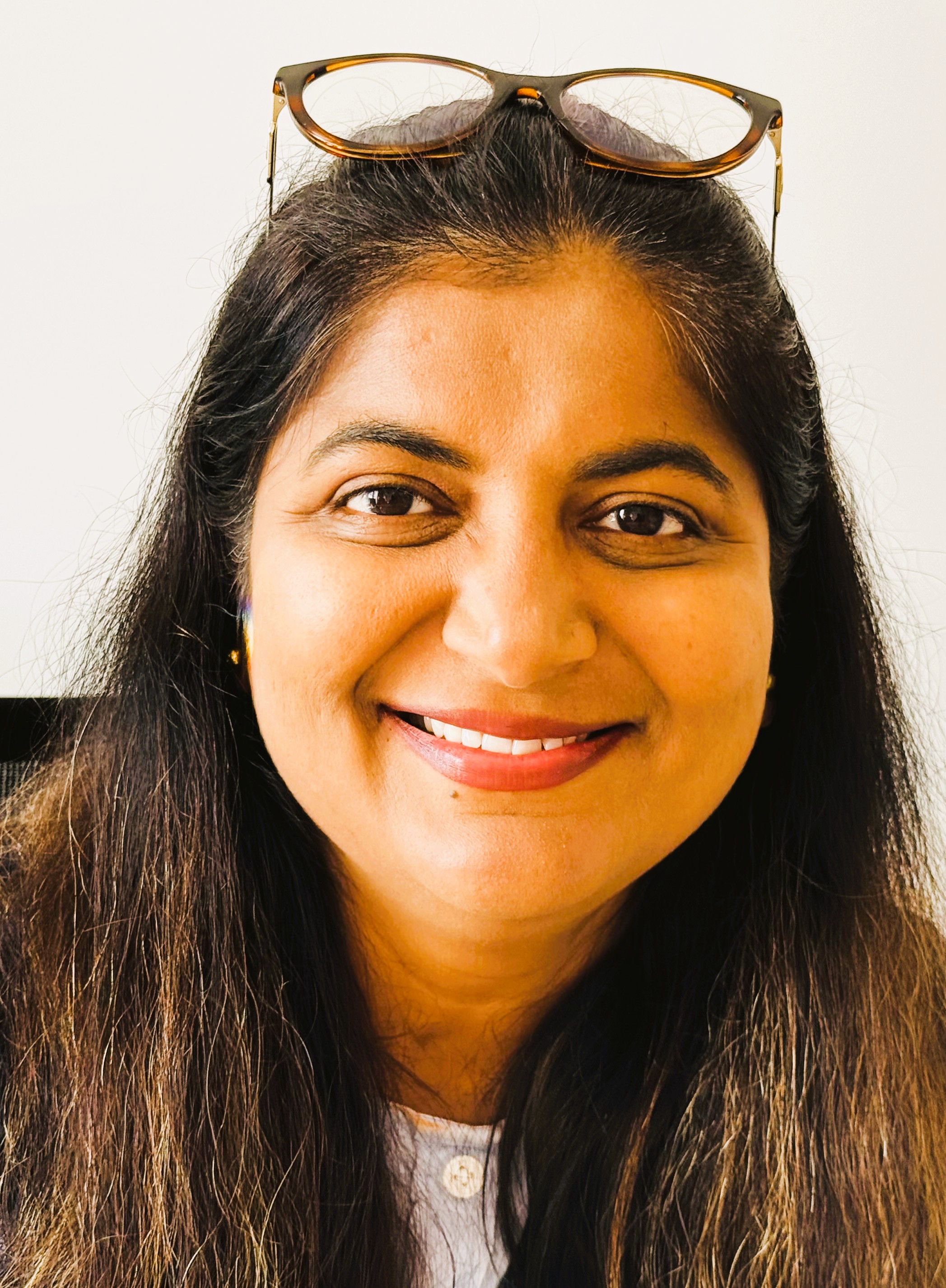 Woman with long wavy black hair.