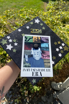 A grad cap with Rocky the Bull on it that reads "In My USF Graduate ERA"