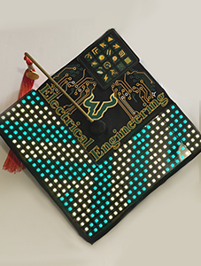 USF grad cap decorated with LED lights with text reading "Electrical Engineering"