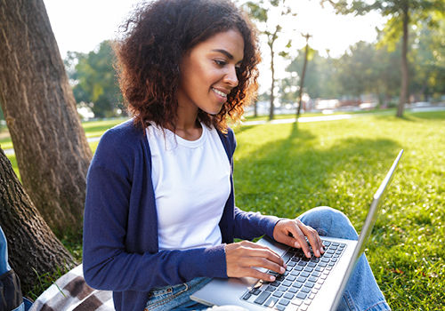 codebreakhers-camp-young-woman-using-laptop