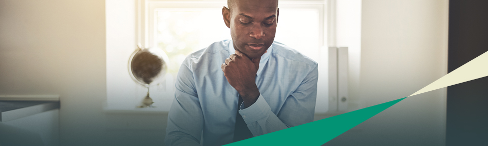 A man in a blue shirt building resilience for lawyers and paralegals.