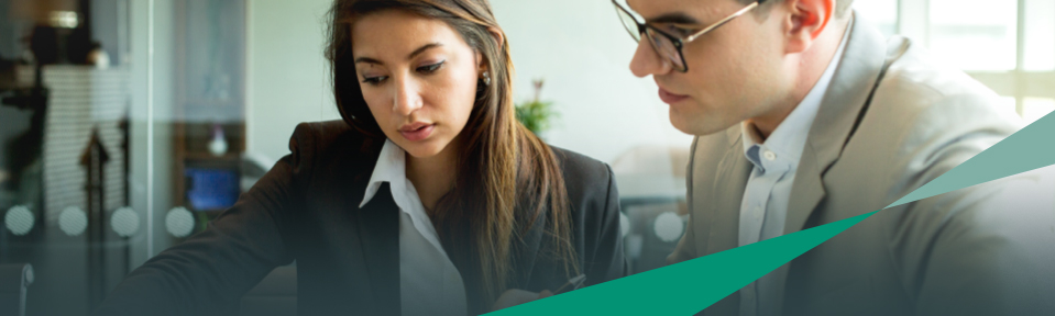 Two employees working on USF's Lean Six Sigma Black Belt Certification.