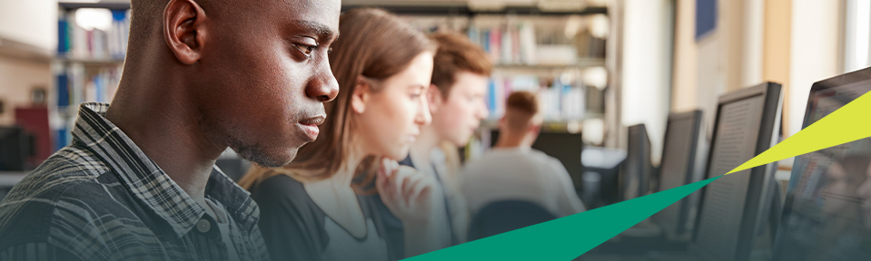 A row of students taking a test prep course.