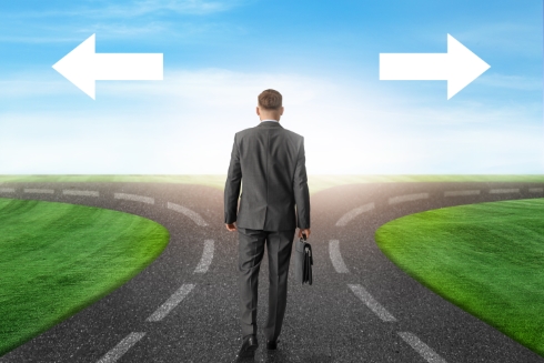 Business man at a crossroads