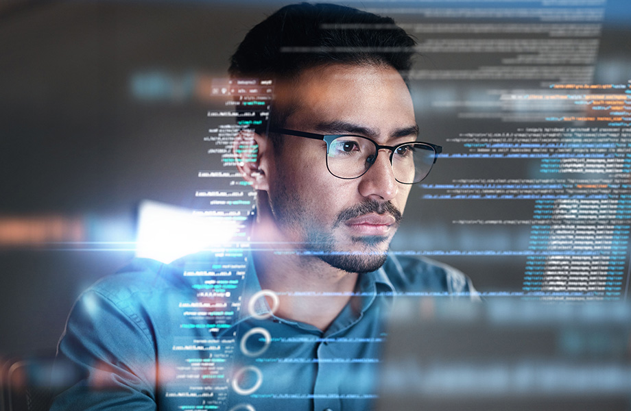 A man stares at a computer screen
