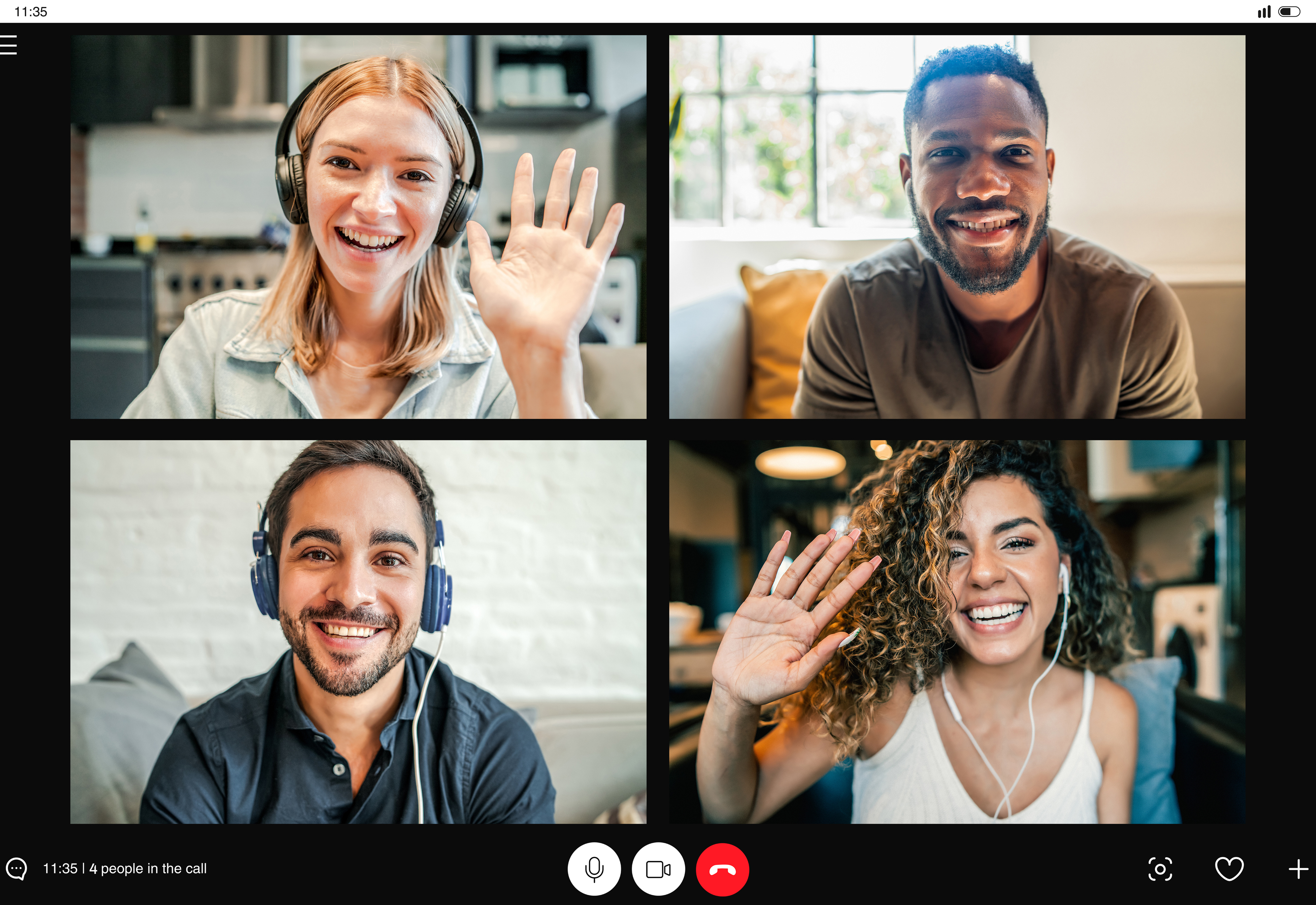 A group of four people having a virtual meeting together
