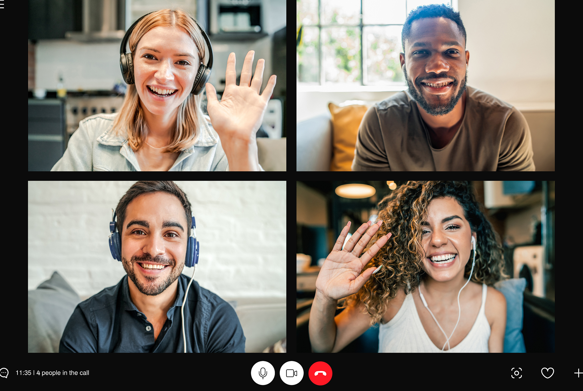 A group of four people having a virtual meeting together