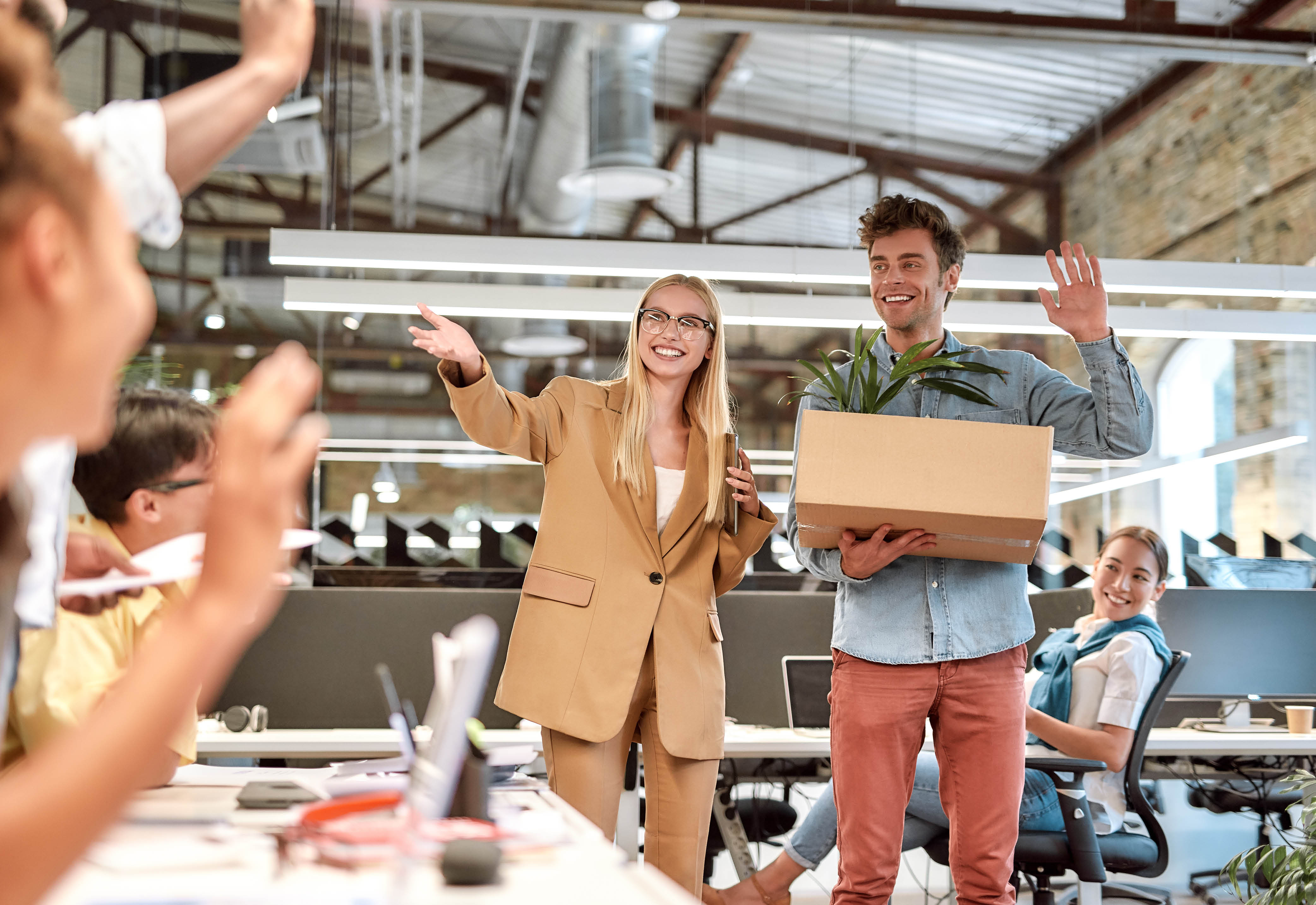 An employee being introduced to the team in their workplace. 