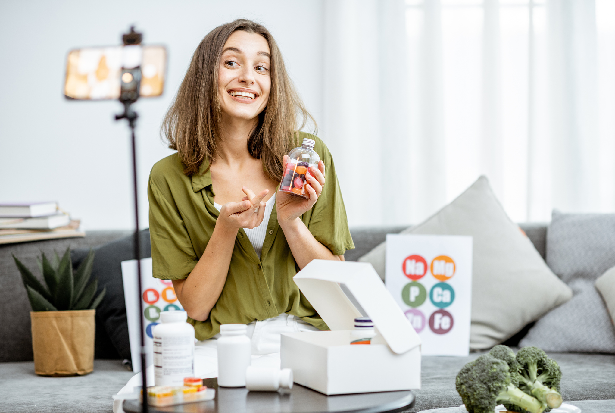 A woman filming herself talking about a product