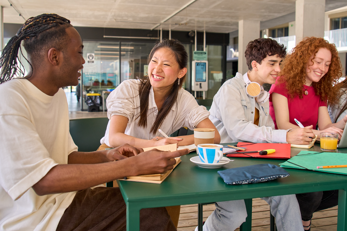 A group of people sitting at a table together 