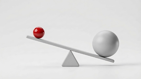 A seesaw balanced with balls