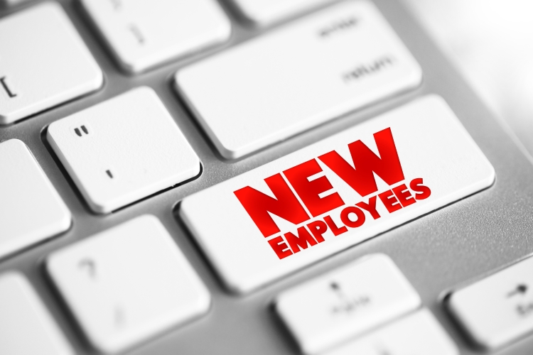 A keyboard with a New Employees button