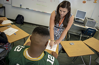 USF student teacher tutoring a middle school student