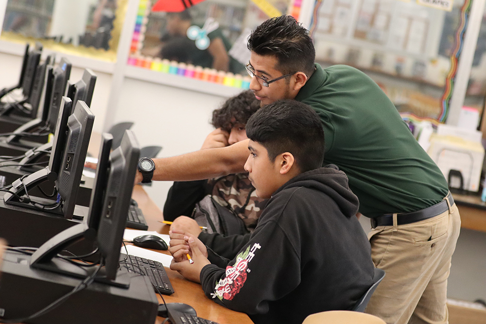 Tutor a Bull student in library with students