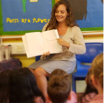 Student reading to class