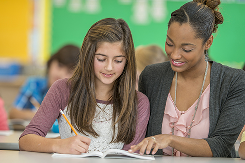 English teacher working with student