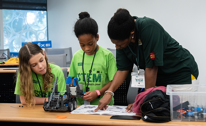 Students and teachers working together during STEM camp