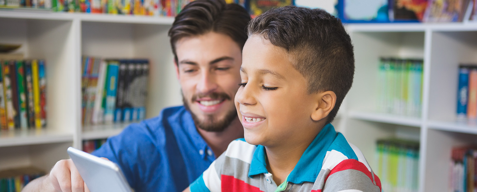 Teacher teaching a young student 