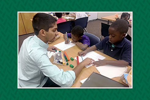 USF MAT student tutoring an elementary student in math