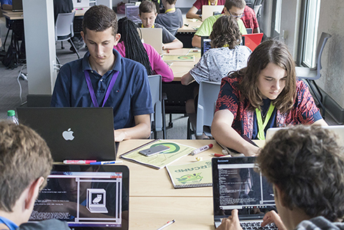 Students on laptops at USF CyberCamp 2018