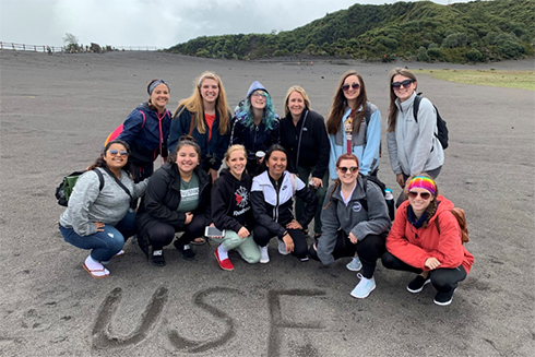 USF students on a beach in Costa Rica with 
