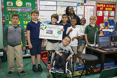USF ESE major with students at local elementary school