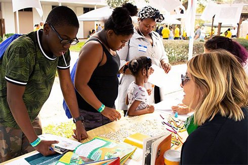 USF faculty member at Passport to Literacy event