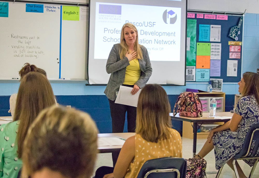 Jennifer Rinck presenting during a teacher leadership class session.