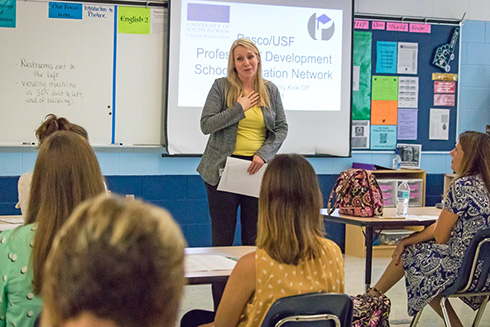 Jennifer Rinck presenting during a teacher leadership class session.