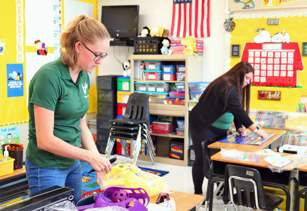 USF students setup a classroom together