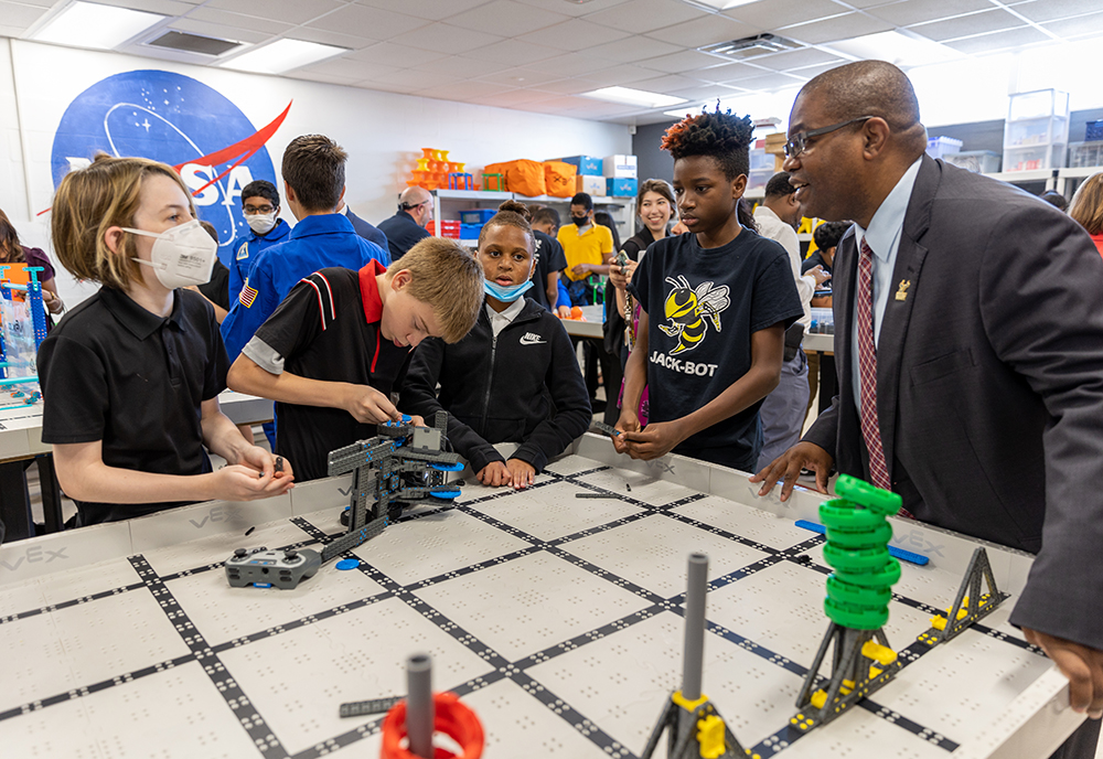 Dean R. Anthony Rolle observes students in a robotics class at Stewart Middle Magnet School in Tampa