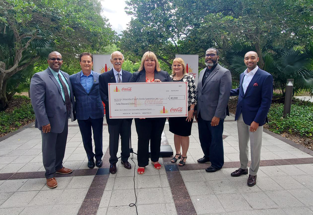 Group photo at Stavros Center check presentation