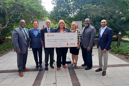 Group photo at Stavros Center check presentation