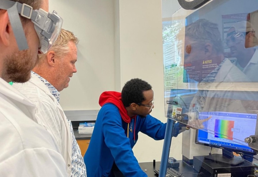 APSI teachers work on a chemistry lab