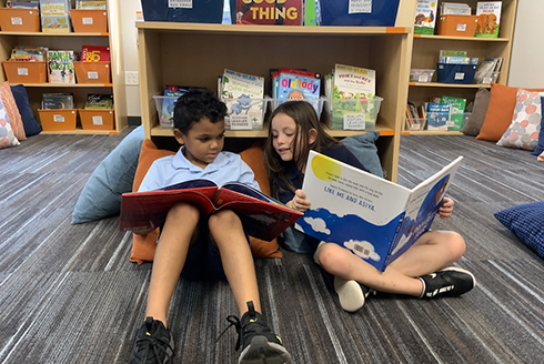 Two children reading 