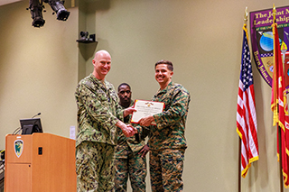 Captain Puffer and Issa with his award