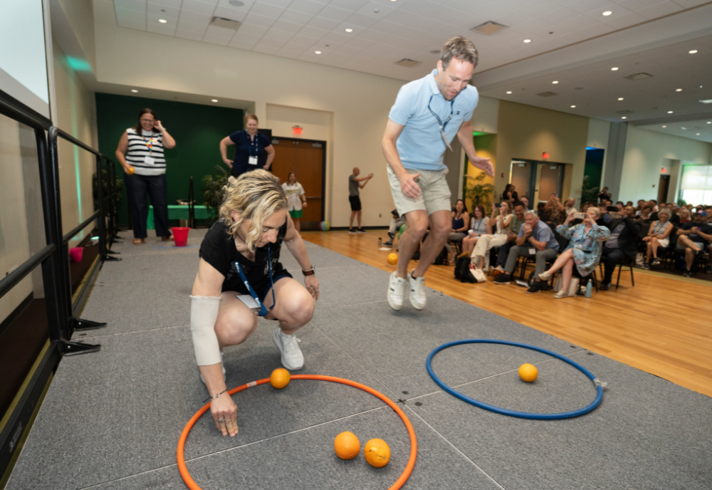 Engagement turned interactive as audience members raced AIESEP board members in a cheerful on-stage orange relay.