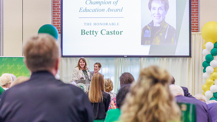 Interim Dean Jenifer Jasinski Schneider and Betty Castor on stage for the presentation of the Champion of Education Award