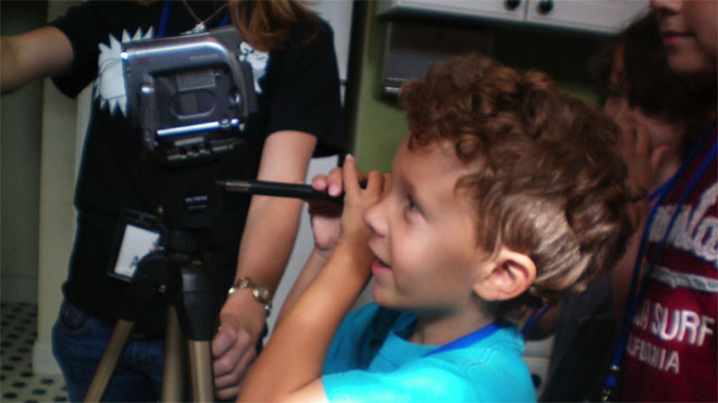 Child recording footage with a video camera
