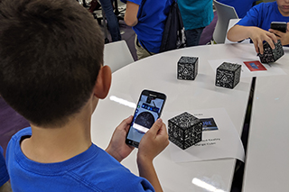 Student using augmented reality on their phone