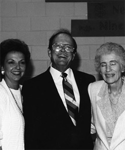 Dr. William Katzenmeyer poses with two women