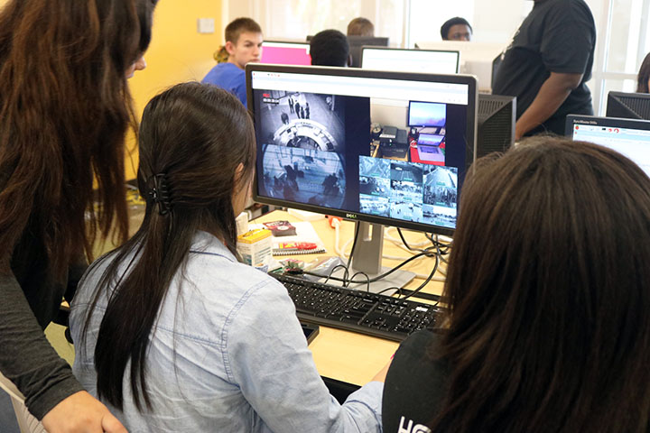 Students hack into a fake security footage system as they learn about cybersecurity principles at GenCyber camp