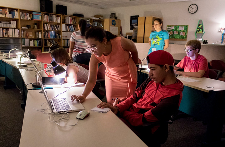 Dani Bowman works with a student at VSA Florida Animation Camp 2018