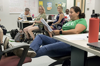 TBAWP writer shares writing during presentation