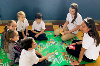USF student teaches a lesson in a classroom in Costa Rica
