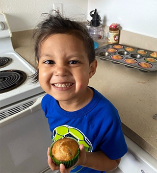 Child cooking at home in kitchen