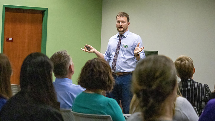 Dr. Nathaniel von der Embse gives a presentation to the audience about teacher emotional well-being