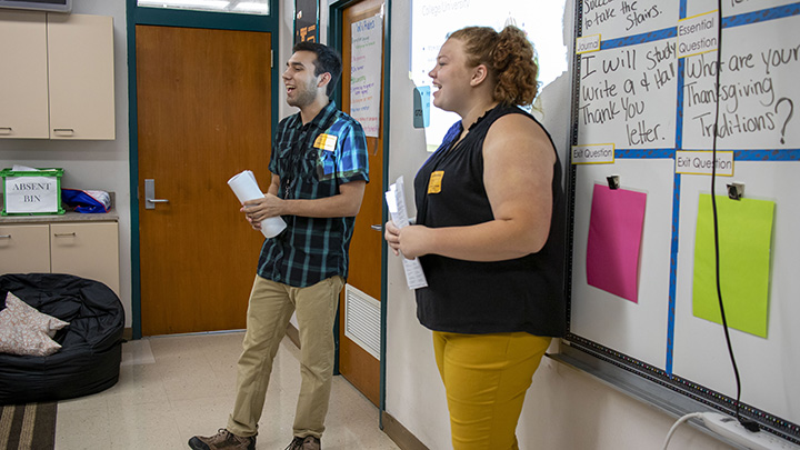 USF student teachers conducting a financial literacy lesson in a high school classroom