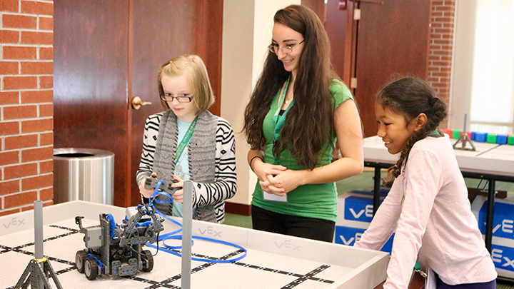 Students work with USF mentor at Robotics practice field